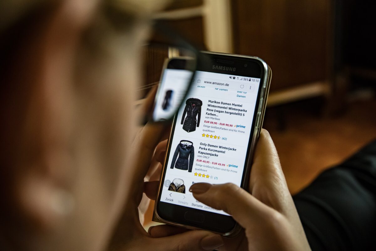 Woman scrolling on amazon on mobile phone