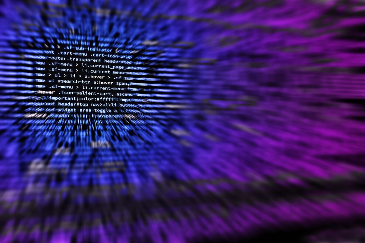 Code on screen blurred into blue