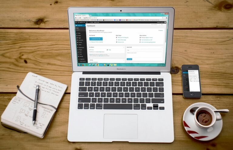 Macbook on a desk with Wordpress on screen
